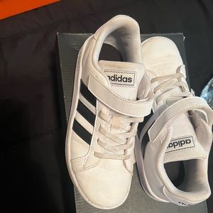 White with black size 1 1/2 youth adidas shoes wore once little dirty .